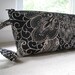 black and cream floral wristlet
