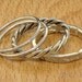 Set of 4 stacking rings reticulated, twisted and skinny textured bands