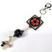 Square Funky Bone With Pink Flower Purse Charm