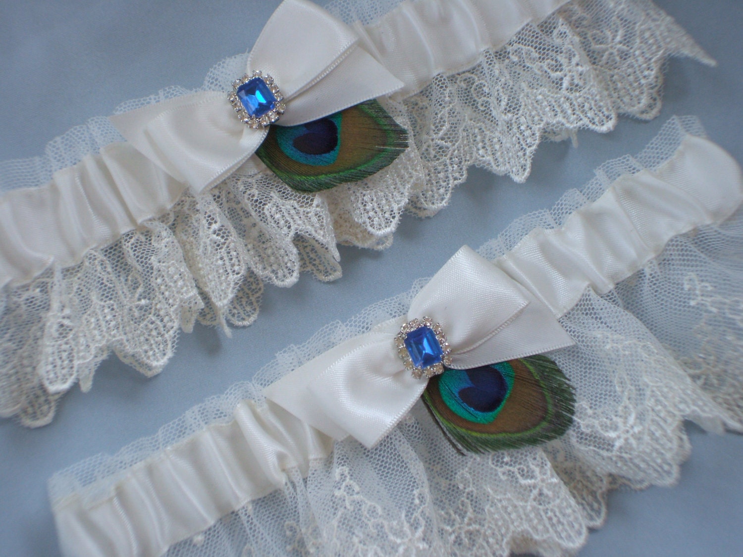Ivory Bridal Lace Peacock Feather Royal Blue Rhinestone Accented Bridal Wedding Garter Set