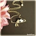 Love Birds Necklace Birds Kissing on a Tree by SnobishDesign from etsy.com