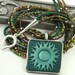 Necklace Multi Strand Green Brown Woodland Sun Pendant