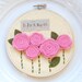 5 inch hoop art: "blossom" with pink felt rosettes.