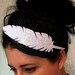 Fascinator black with white irridescent glitter feather in straw