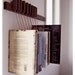 Custom made wooden book rack in Wenge. Movable pins.The pins also work as bookmarks.