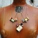 Spring Library Book Necklace: 9 antique and scrap leather covered books.