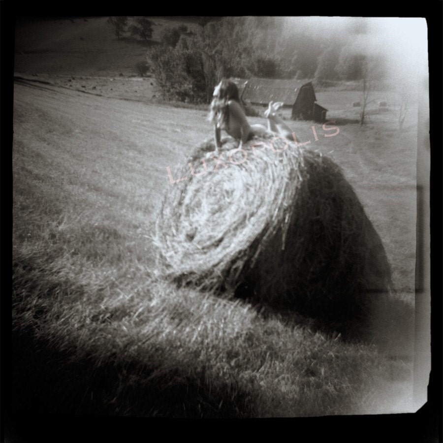 Nude naked farm girl on hay bale, summer midwest, Fine Art photo