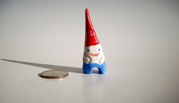 Mini ceramic garden gnome for pocket travel or potted plants