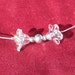 Wedding necklace, tiny white Lucite flowers, silver balls and chain
