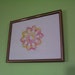 framed tatted art amusement doily in yellow and pink