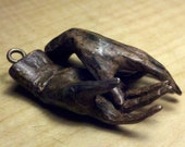 2" long small bronze hands with bronze screw eyes,