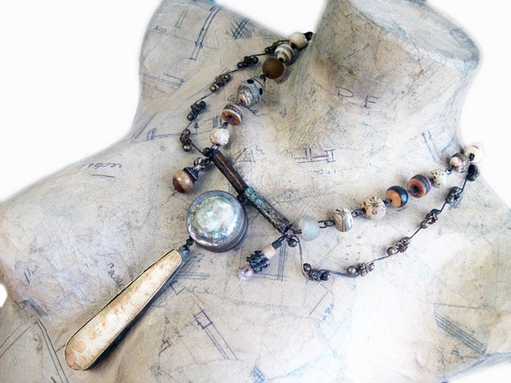 In Your Light. Iridescent Victorian Tribal statement necklace with art beads, lampwork, ceramics doll face assemblage.