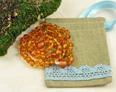Baltic Amber Baby teething necklace honey cognac, polished, baroque beads in Lovely Linen gift bag
