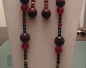 3 piece jewelry set.  Necklace, Dangle earrings and bangle with resin and wood beads. Fits most wrists.