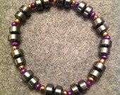 Hematite and stone beads. Fits most wrists. (Men)