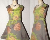 Olive green Cotton Jersey Spring Dress with red feathers, metallic bronze firework remnant, and  green tie dye screenprint