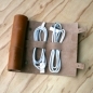Cordito cord wrap that holds 3 cables and 2 plugs.