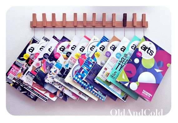 Custom made wooden book/magazine rack in Beech.The pins also work as bookmarks. Free shipping